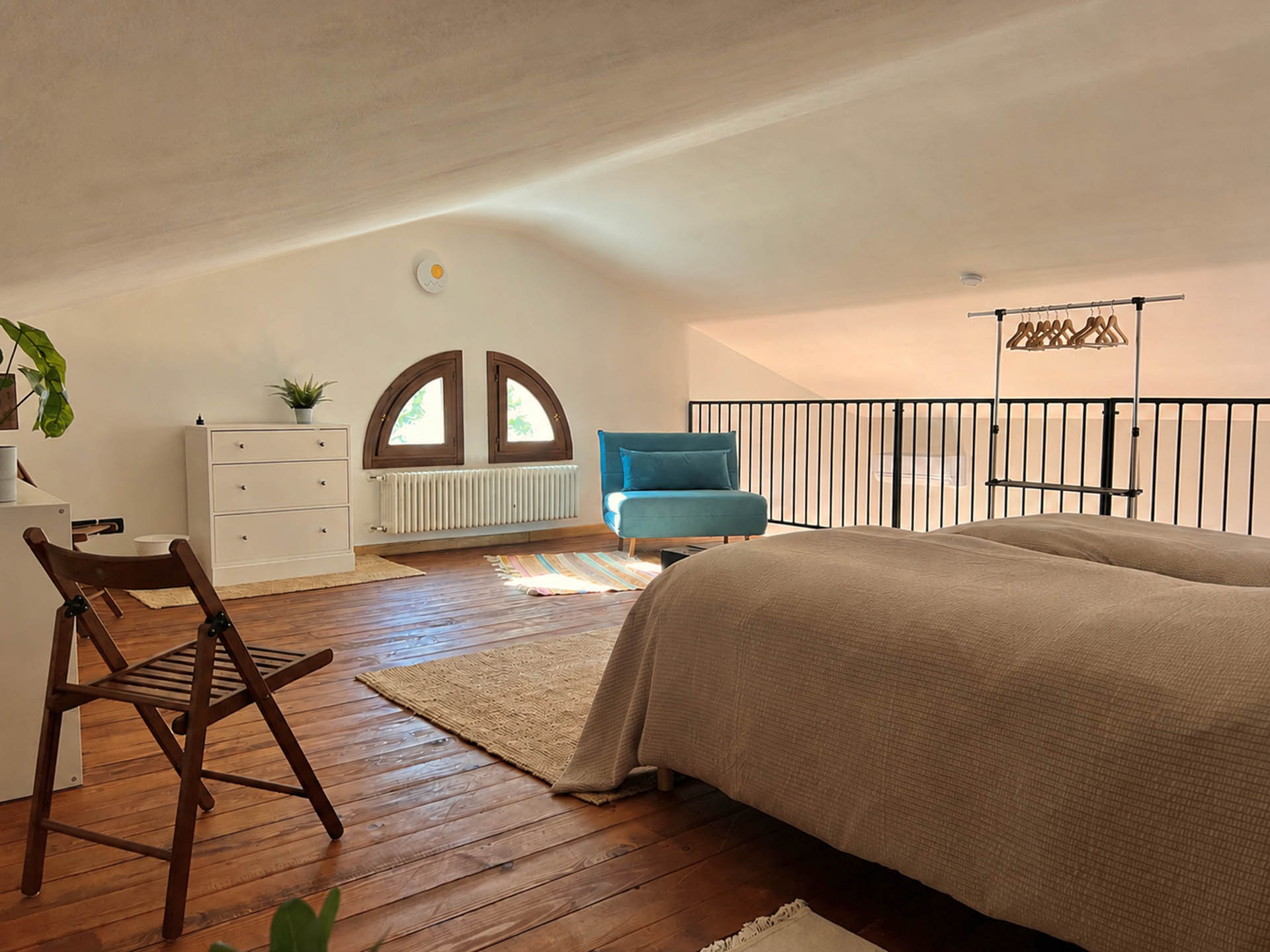 Loft bedroom with king-size bed at Dolce Collina Holiday Home in Dozza